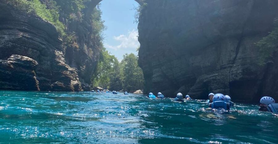 Alanya/City of Side: Canyoning, Rafting and Ziplining Tour - Walking into the cold water at Koprulu Canyon