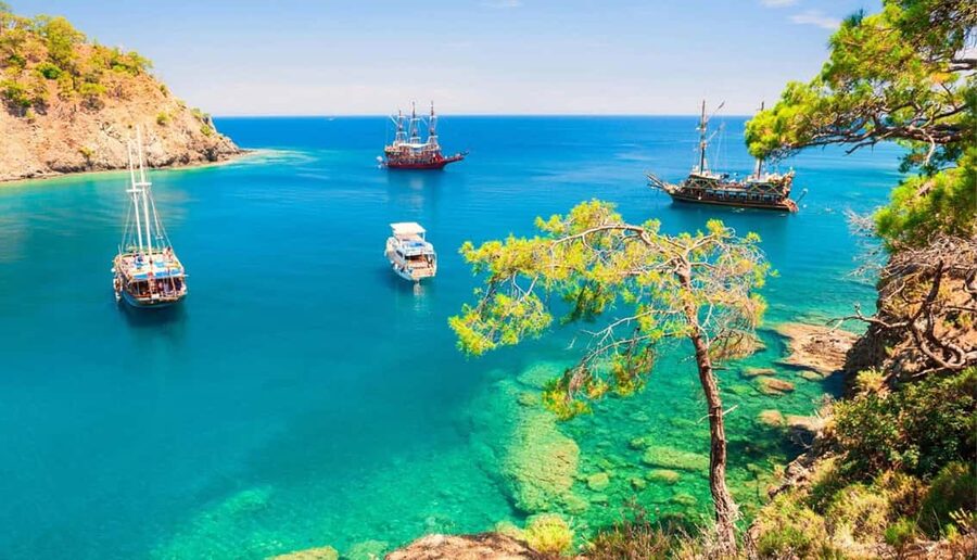 Antalya & Kemer: Pirate Boat Tour With Foam Party & Swimming - Boarding the traditional boat from Kemer
