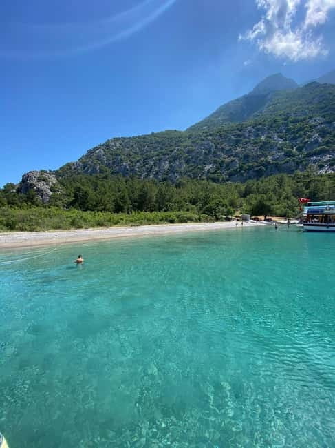 Antalya/Kemer: Suluada Boat Tour with Bays & Maldives Beach - Waterfall Bay adds rocks and a natural setting