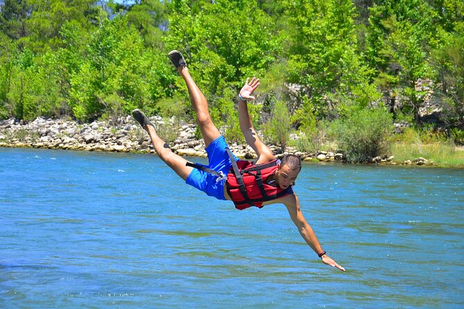 "Side: Whitewater Rafting Fun at Koprulu Canyon" - The swim break and the wet-weather reality